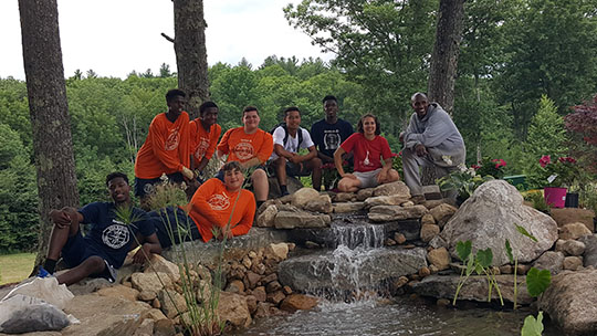 Paul Burton and some of the kids who worked to complete the pond